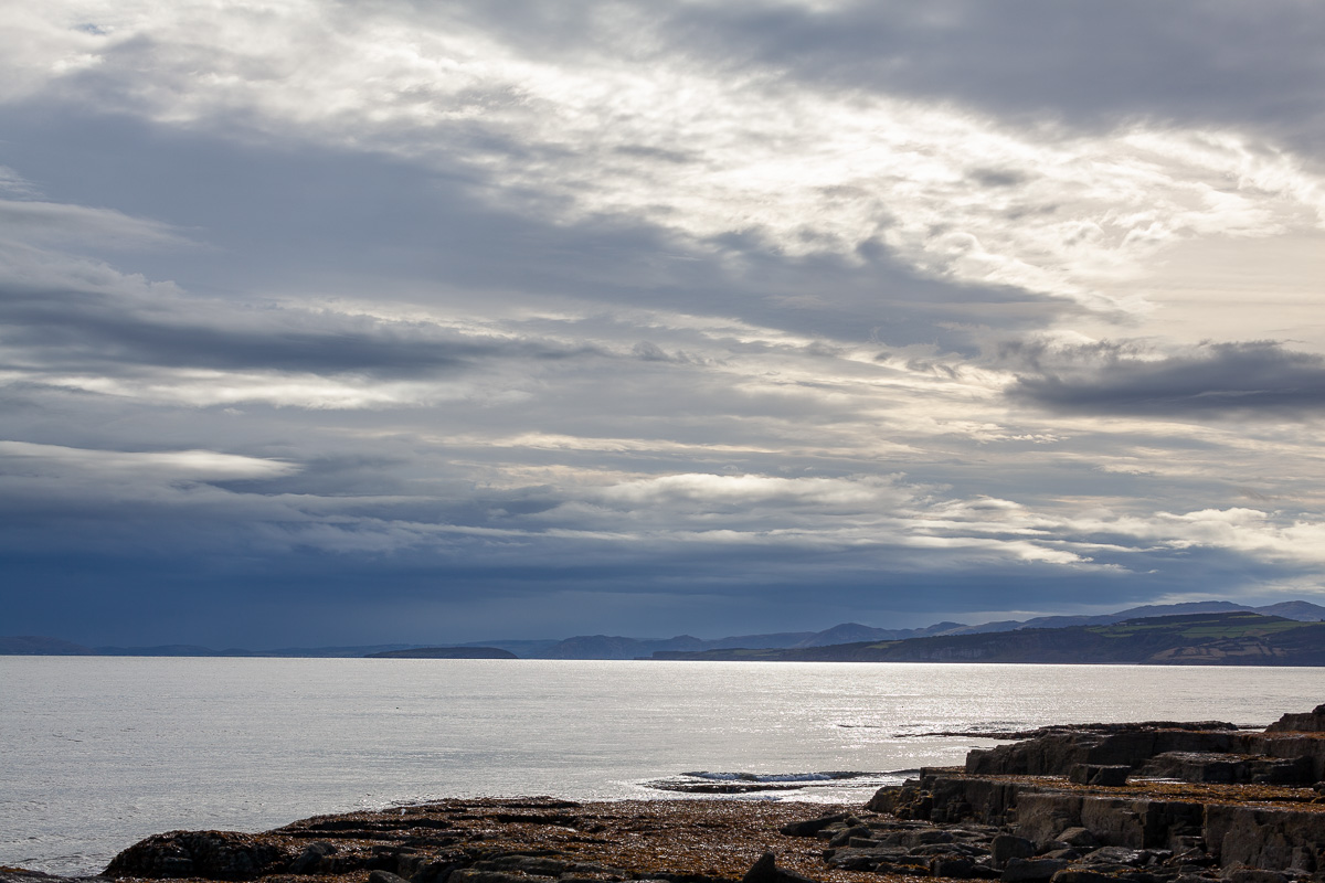 Sitting on a rock with a brew, gazing out to sea