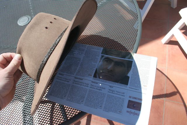 Using my hat to observe a partial solar eclipse, Taormina, 2006